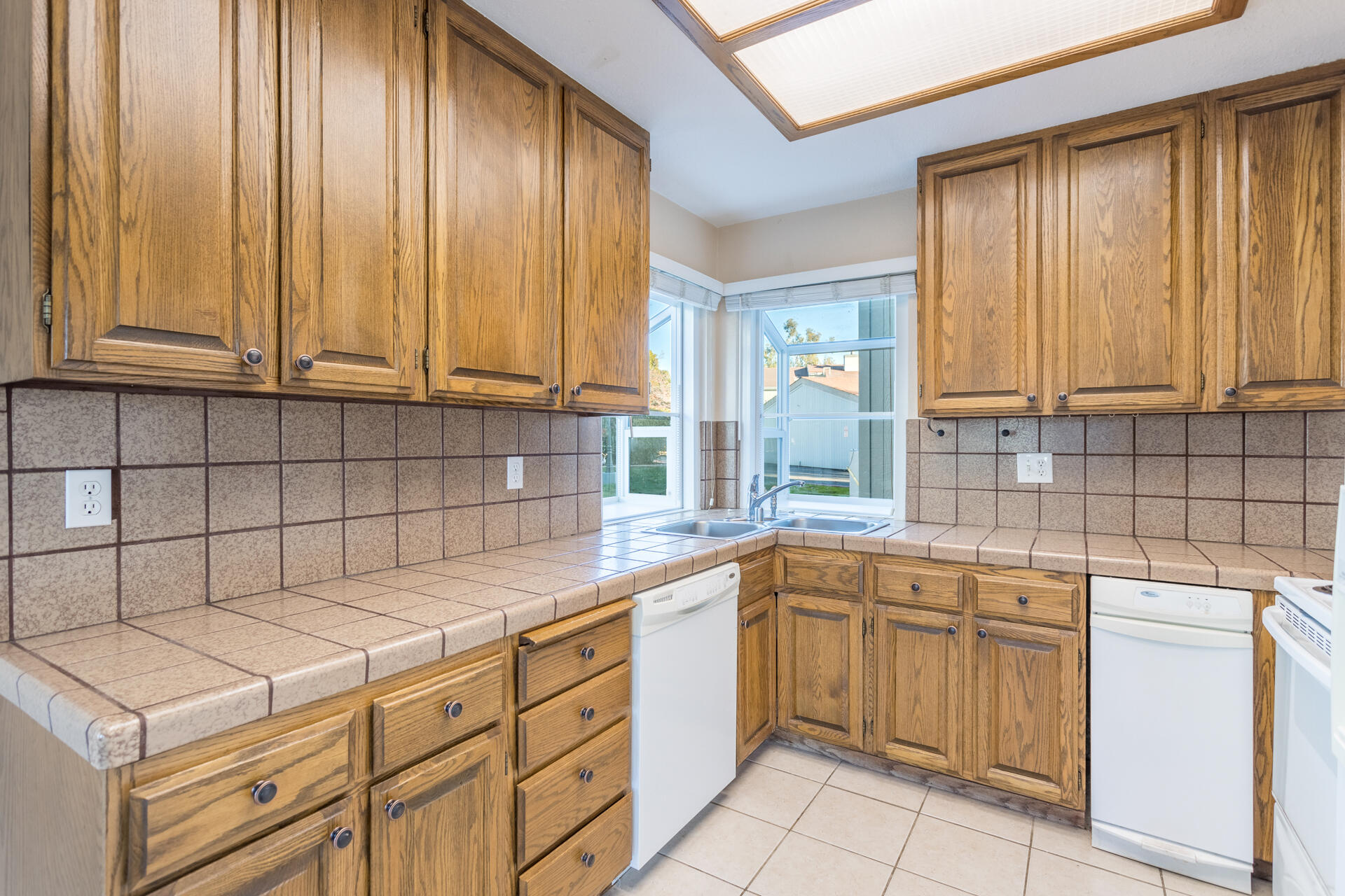 466 Ridgecrest Trail, Unit 136 Redding, CA 96003 - Photo 5 of 16 a kitchen with a sink window and cabinets