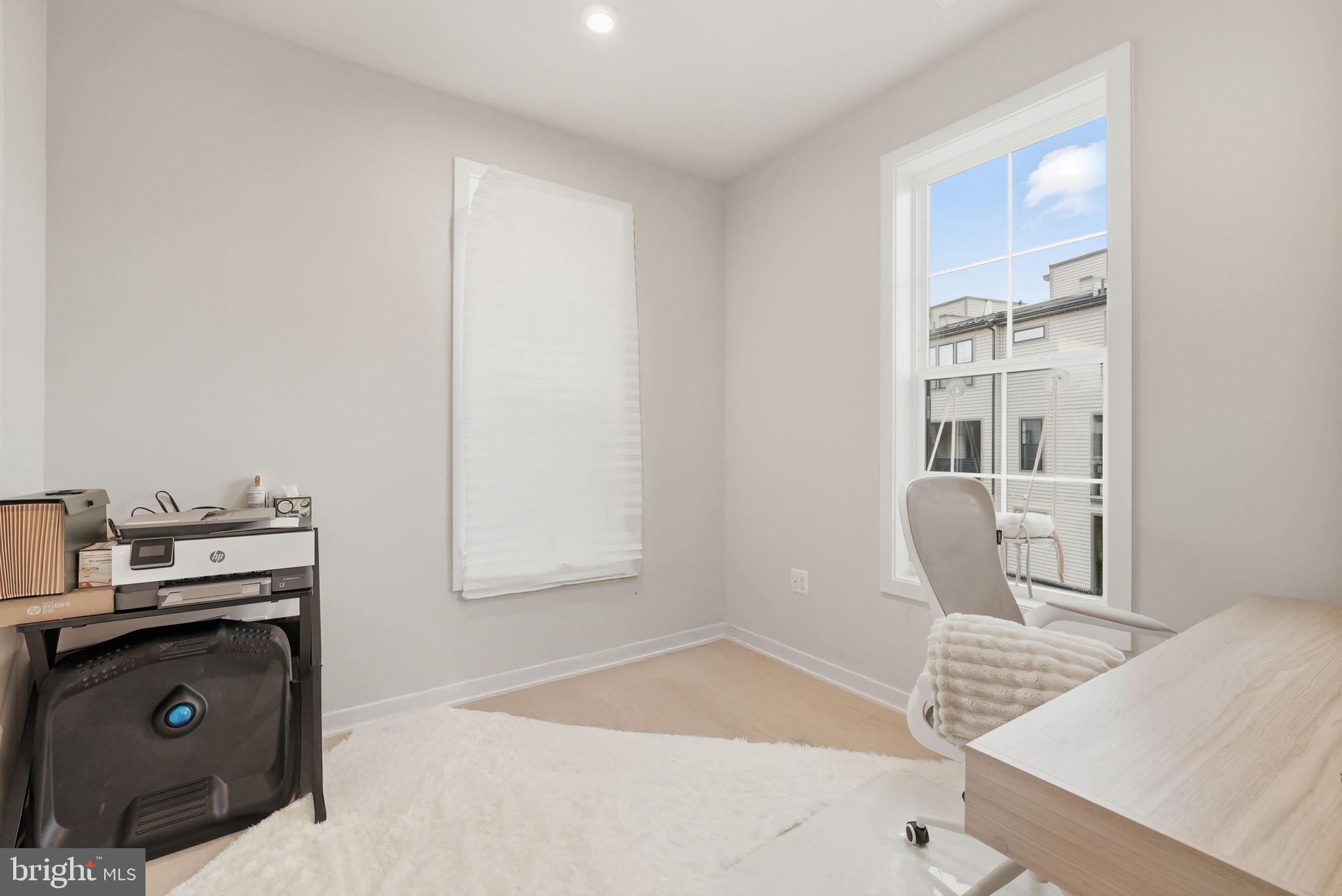 43489 Old Ryan Road Ashburn, VA 20148 - Photo 11 of 30 a living room with a couch and a table in it