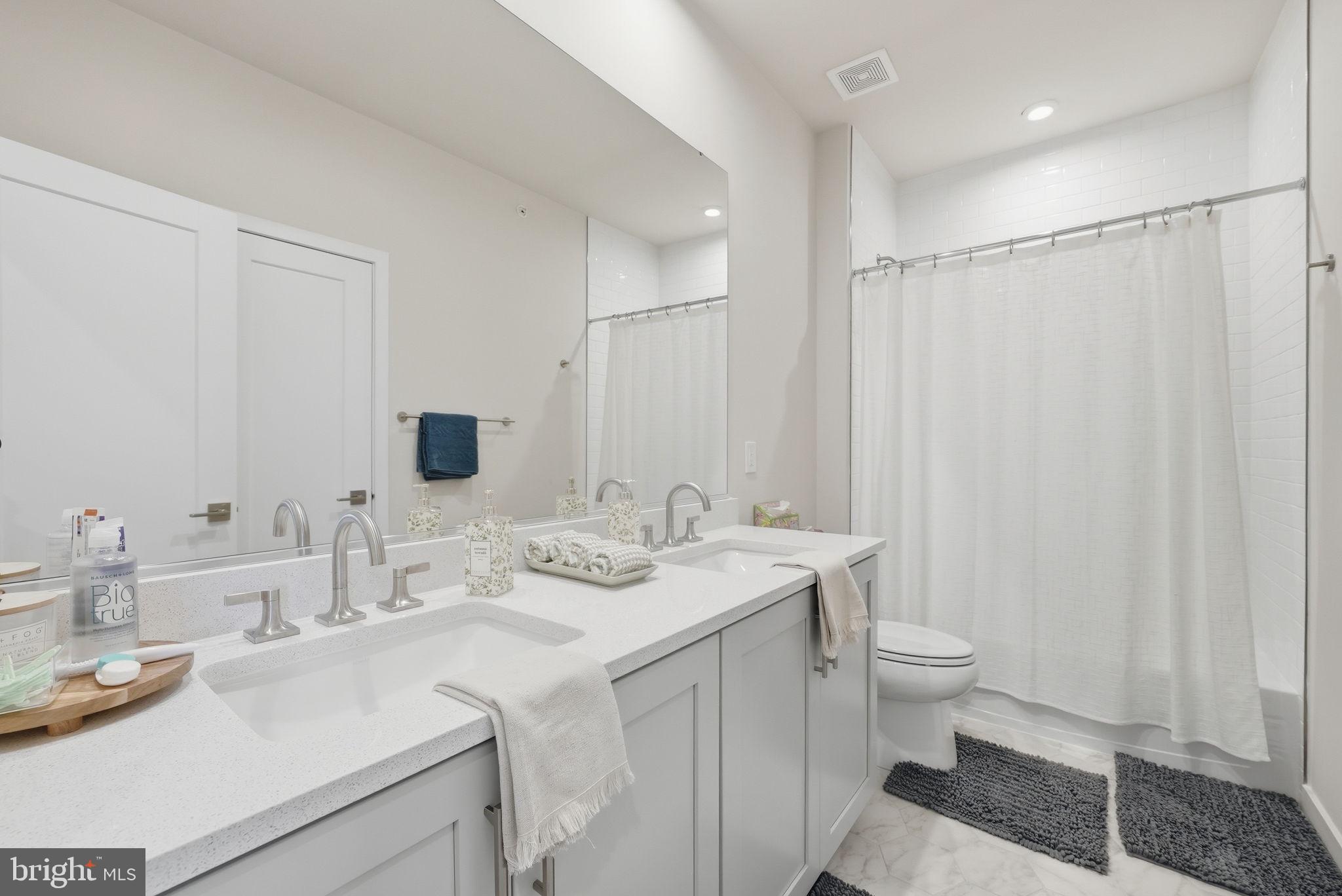 43489 Old Ryan Road Ashburn, VA 20148 - Photo 15 of 30 a bathroom with a sink toilet and shower