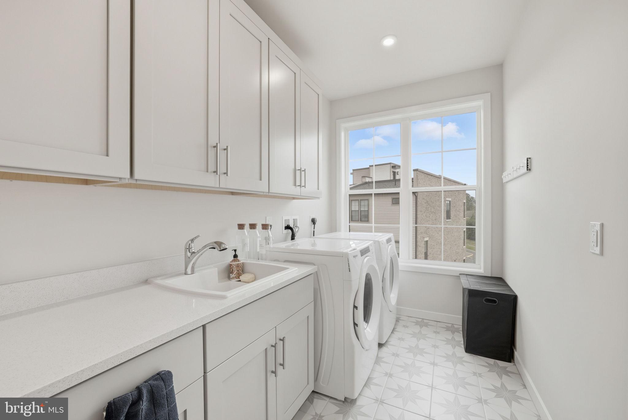 43489 Old Ryan Road Ashburn, VA 20148 - Photo 16 of 30 a kitchen with a sink cabinets and appliances