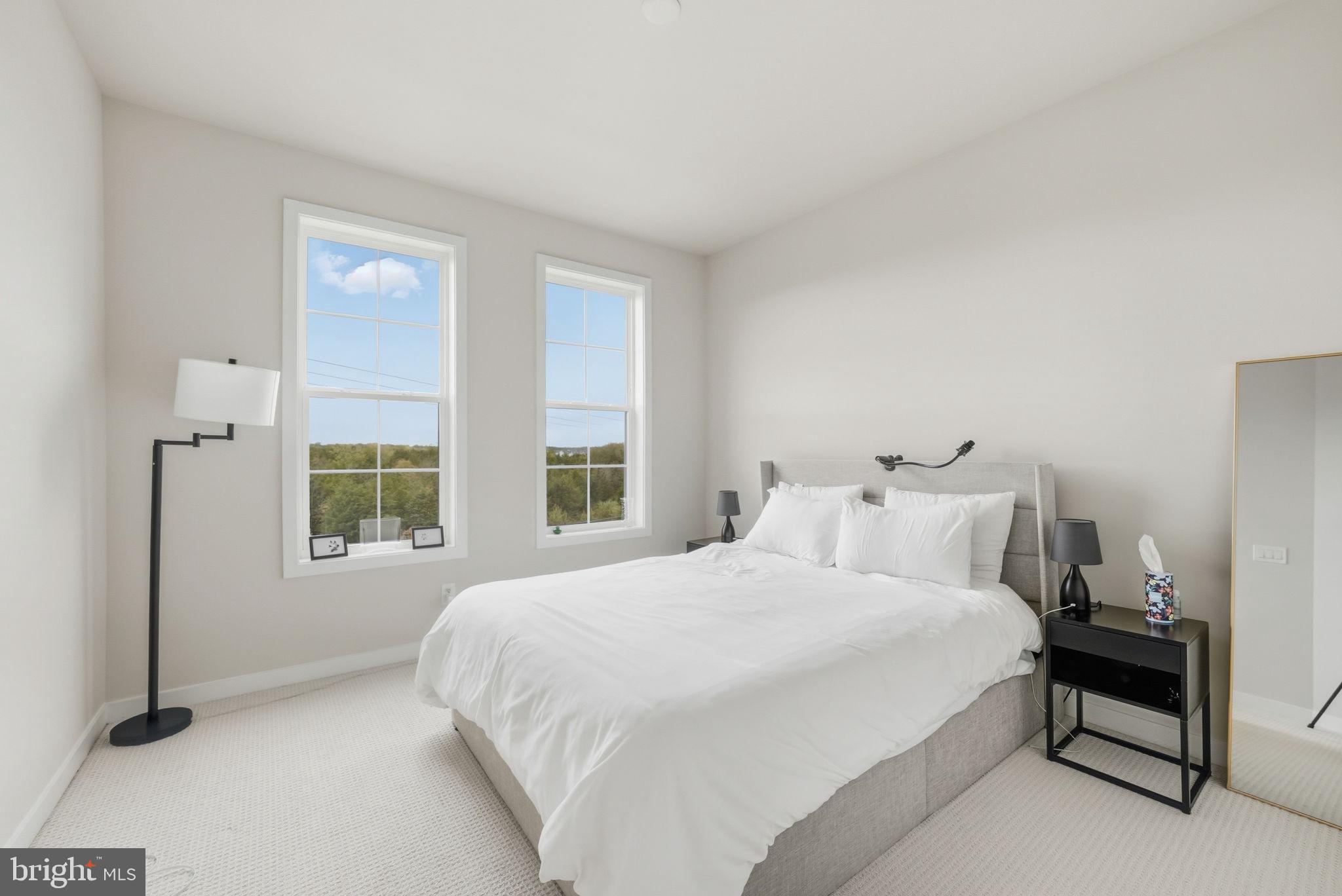 43489 Old Ryan Road Ashburn, VA 20148 - Photo 19 of 30 a bedroom with a bed and a window