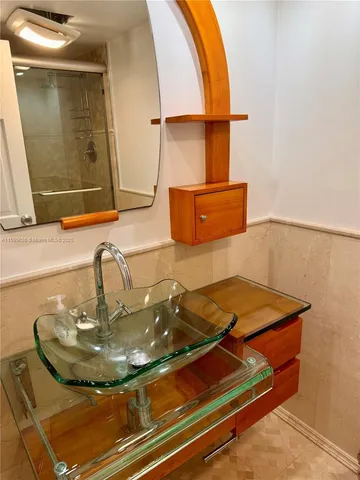 a bathroom with a sink and a mirror