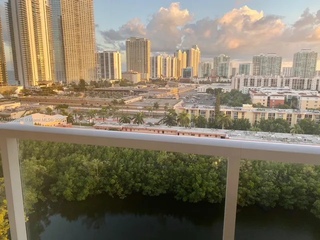 a view of lot of water with tall buildings