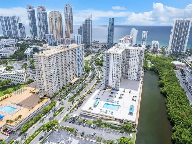 a front view of a building with a lot of windows