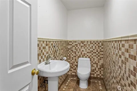 a bathroom with a toilet and a sink