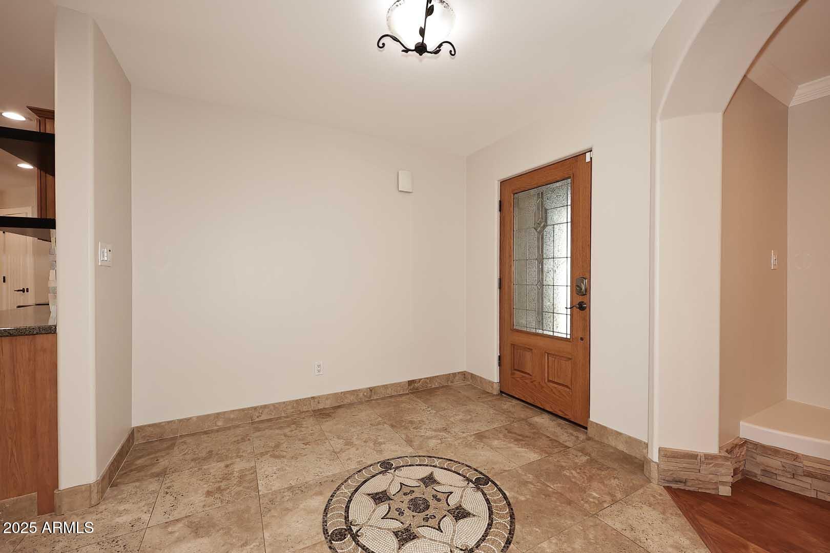 5449 East Thunderbird Road Scottsdale, AZ 85254 - Photo 12 of 75 an empty room with a window and wooden floor