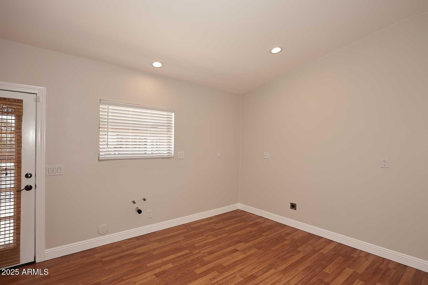 5449 East Thunderbird Road Scottsdale, AZ 85254 - Photo 34 of 75 a view of a room with wooden floor and white walls