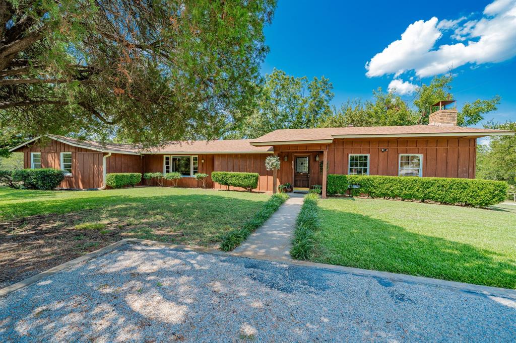 809 Cobb Street Bridgeport, TX 76426 - Photo 1 of 39 a front view of house with yard and green space