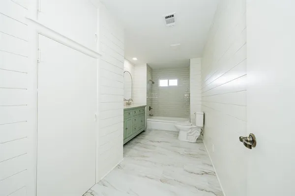 a bathroom with a sink and a toilet