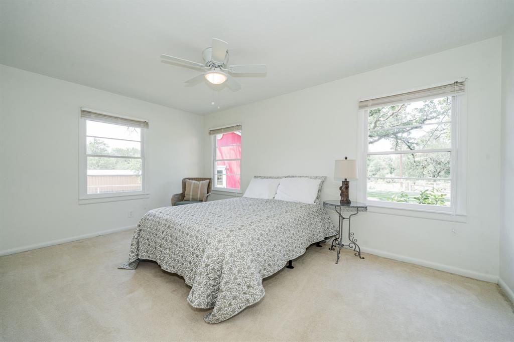 809 Cobb Street Bridgeport, TX 76426 - Photo 22 of 39 a bedroom with a bed and window
