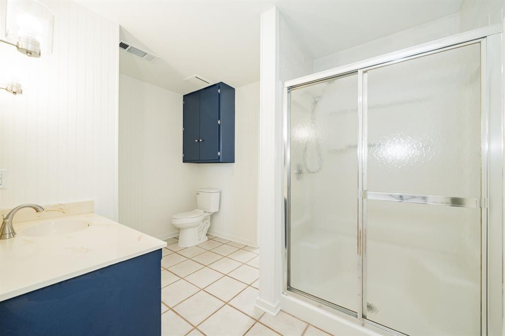 809 Cobb Street Bridgeport, TX 76426 - Photo 30 of 39 a bathroom with a sink a toilet and shower