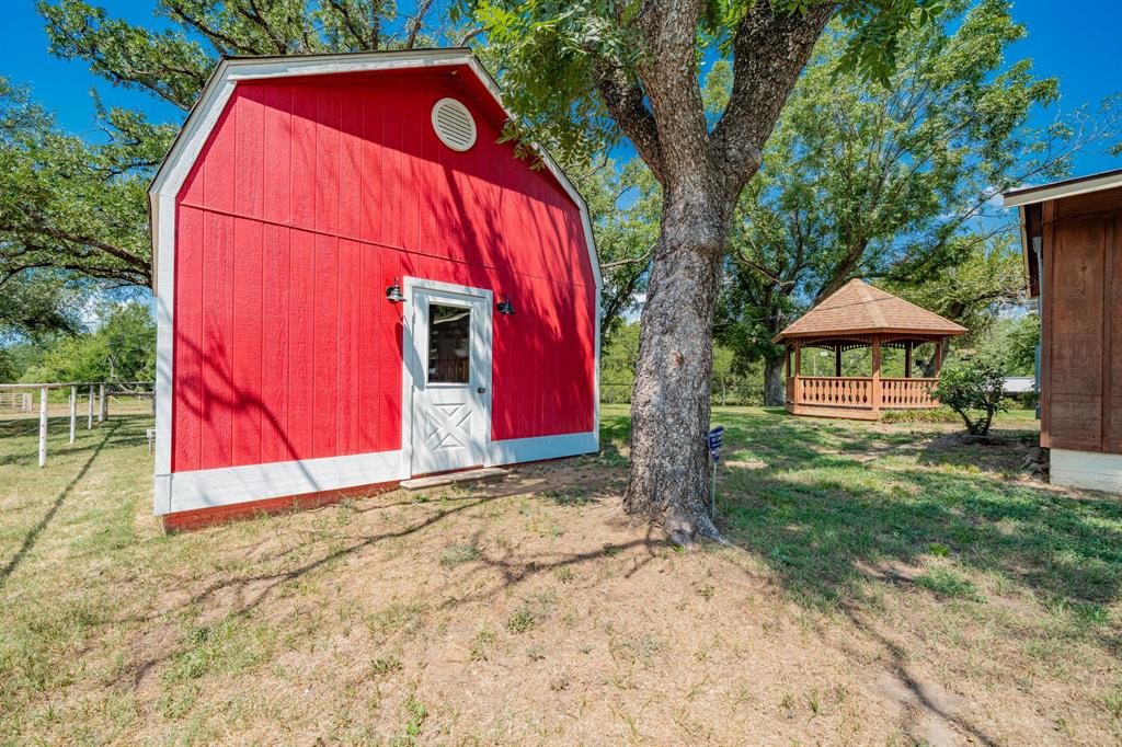809 Cobb Street Bridgeport, TX 76426 - Photo 35 of 39 a view of a house with a backyard