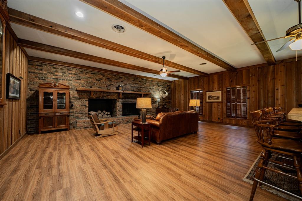 809 Cobb Street Bridgeport, TX 76426 - Photo 9 of 39 a view of a chairs and table on the wooden floor