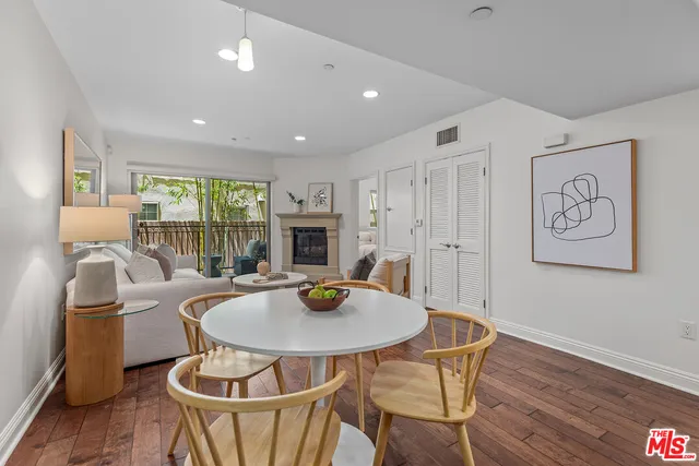 a living room with a table and chairs
