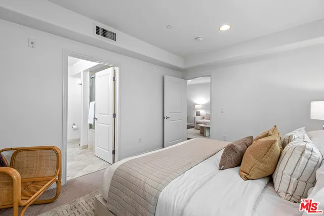 a bedroom with a bed and furniture