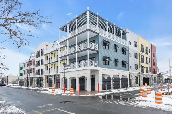a kitchen with a sink a stove and cabinets