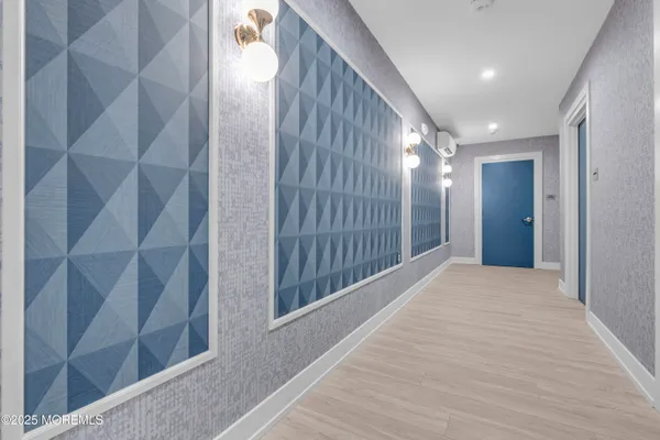 a living room with furniture wooden floor and a flat screen tv