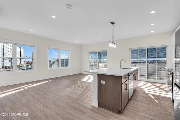 a view of a cars park in front of a building