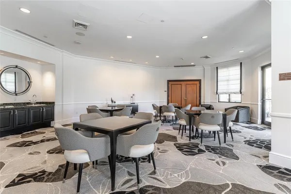 a very nice looking room with a large window and a flat screen tv