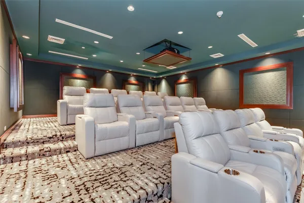 a room with furniture pool table and windows