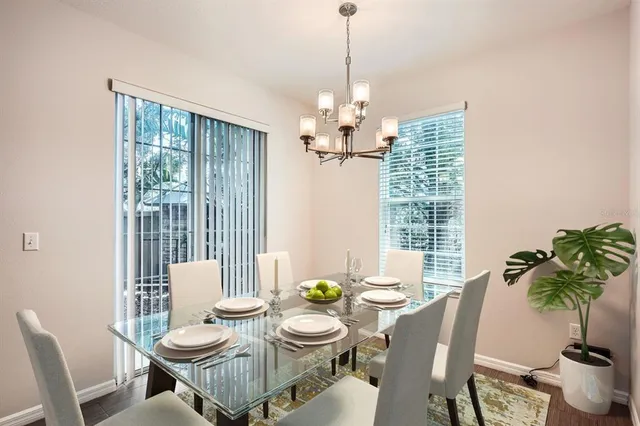a view of a dining room with furniture window and outside view