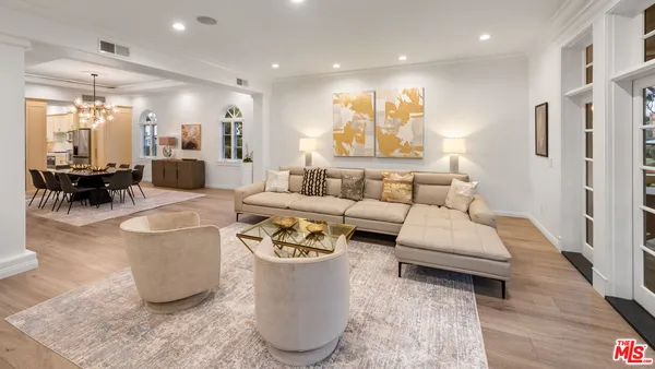 a kitchen with stainless steel appliances granite countertop a sink refrigerator and cabinets