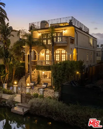 a view of a swimming pool of water with lawn chairs