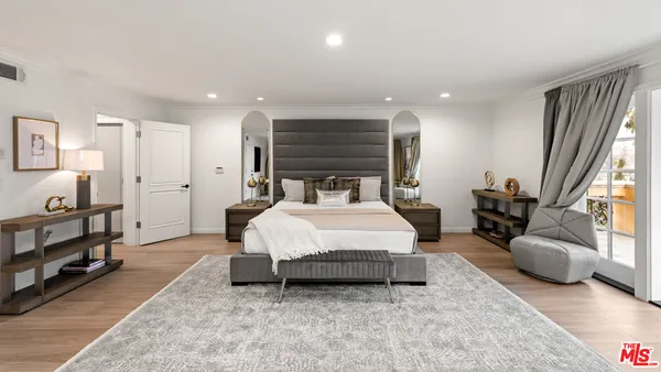 a bathroom with a granite countertop sink a mirror and a shower