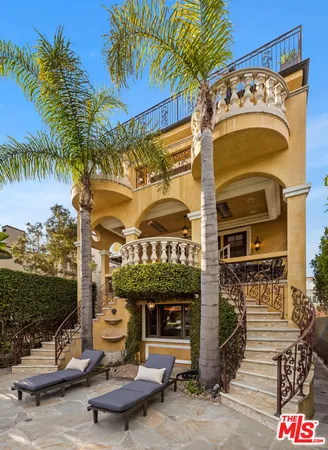 a view of a patio with a table and chairs
