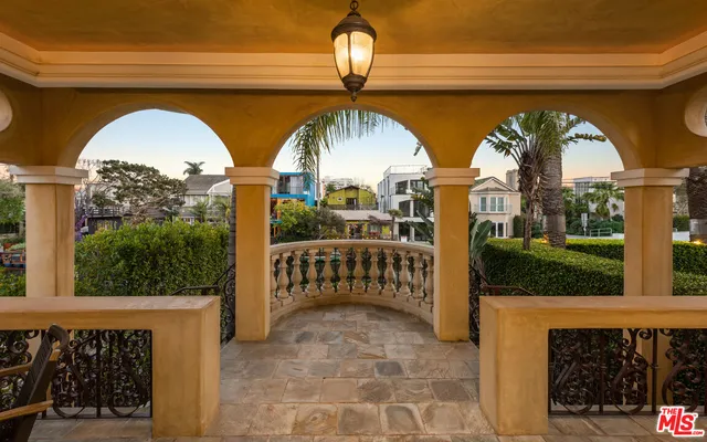 a view of a chairs and table in a balcony