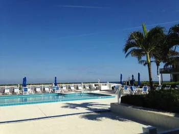 a view of swimming pool with outdoor seating