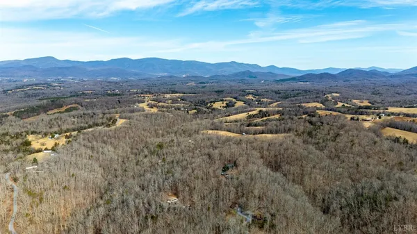 a view of a town with mountains in the background