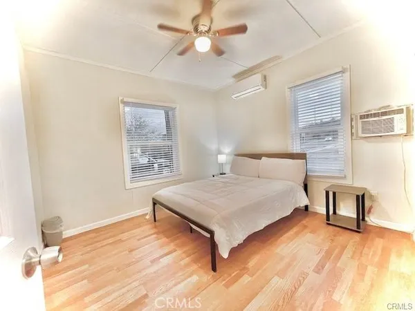 a spacious bedroom with a bed and a table in it