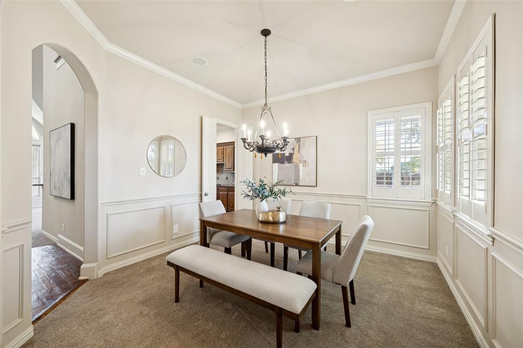 511 Mockingbird Drive Murphy, TX 75094 - Photo 12 of 37 a dining room with furniture a chandelier and window