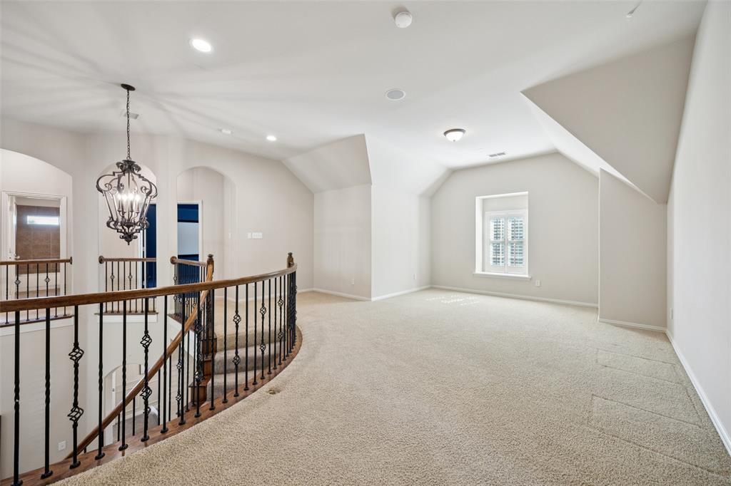 511 Mockingbird Drive Murphy, TX 75094 - Photo 21 of 37 a view of a hallway with windows