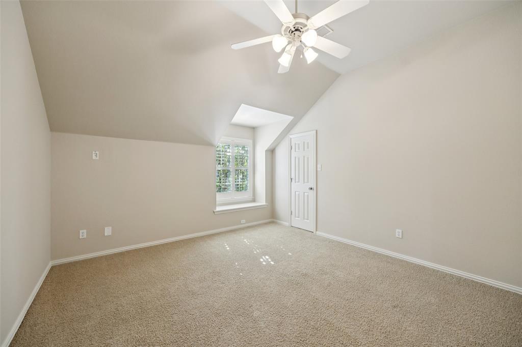 511 Mockingbird Drive Murphy, TX 75094 - Photo 25 of 37 an empty room with windows and fan
