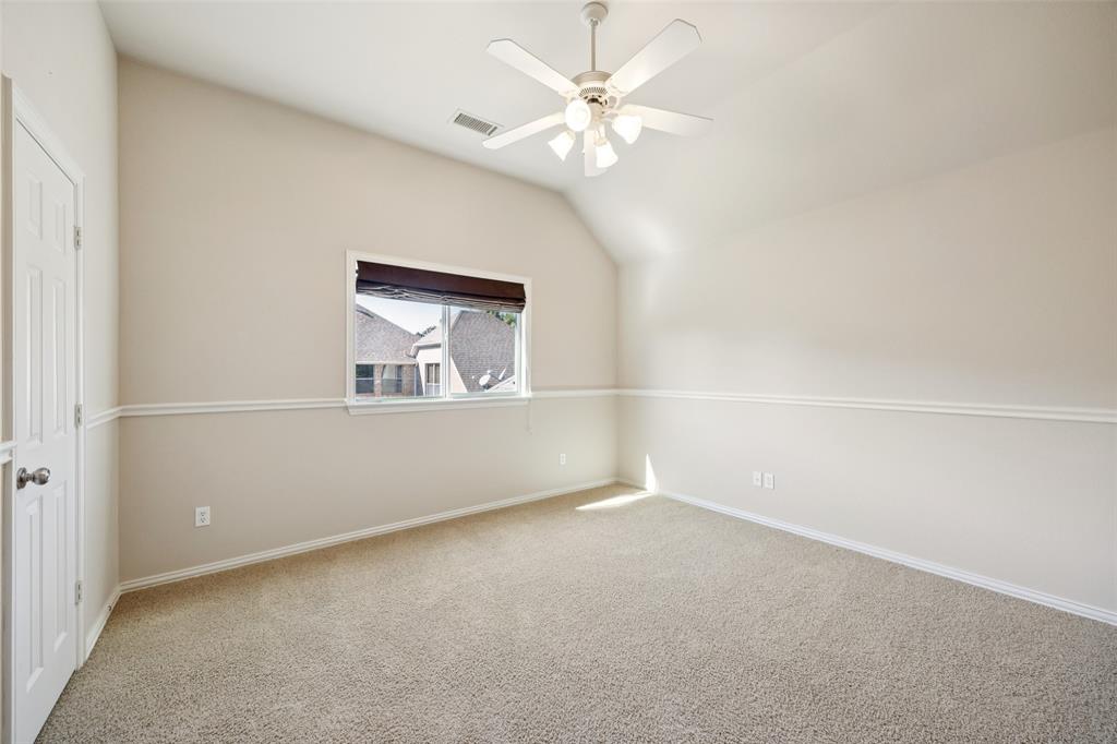 511 Mockingbird Drive Murphy, TX 75094 - Photo 26 of 37 an empty room with a chandelier fan and windows