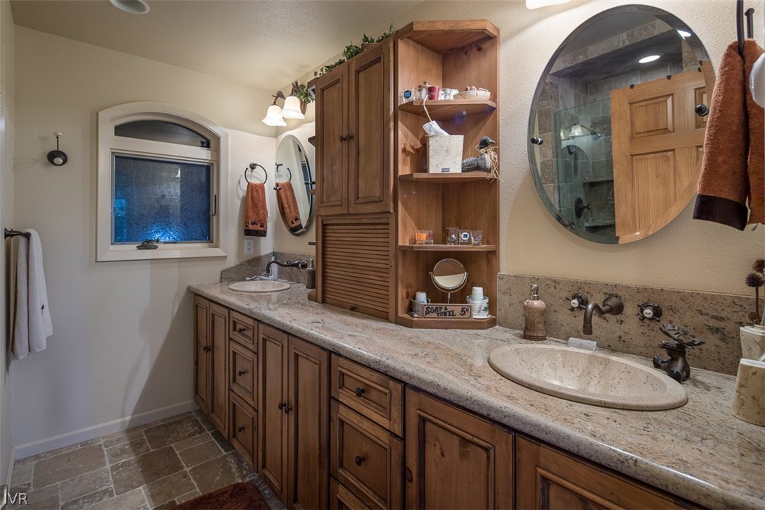 583 Fallen Leaf Way Incline Village, NV 89451 - Photo 11 of 30 a bathroom with a double vanity sink and a mirror