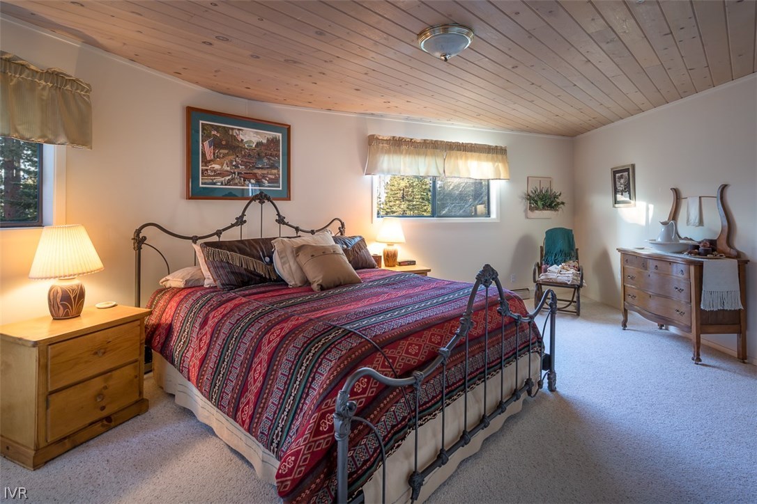 583 Fallen Leaf Way Incline Village, NV 89451 - Photo 12 of 30 a bedroom with bed and paintings on the wall