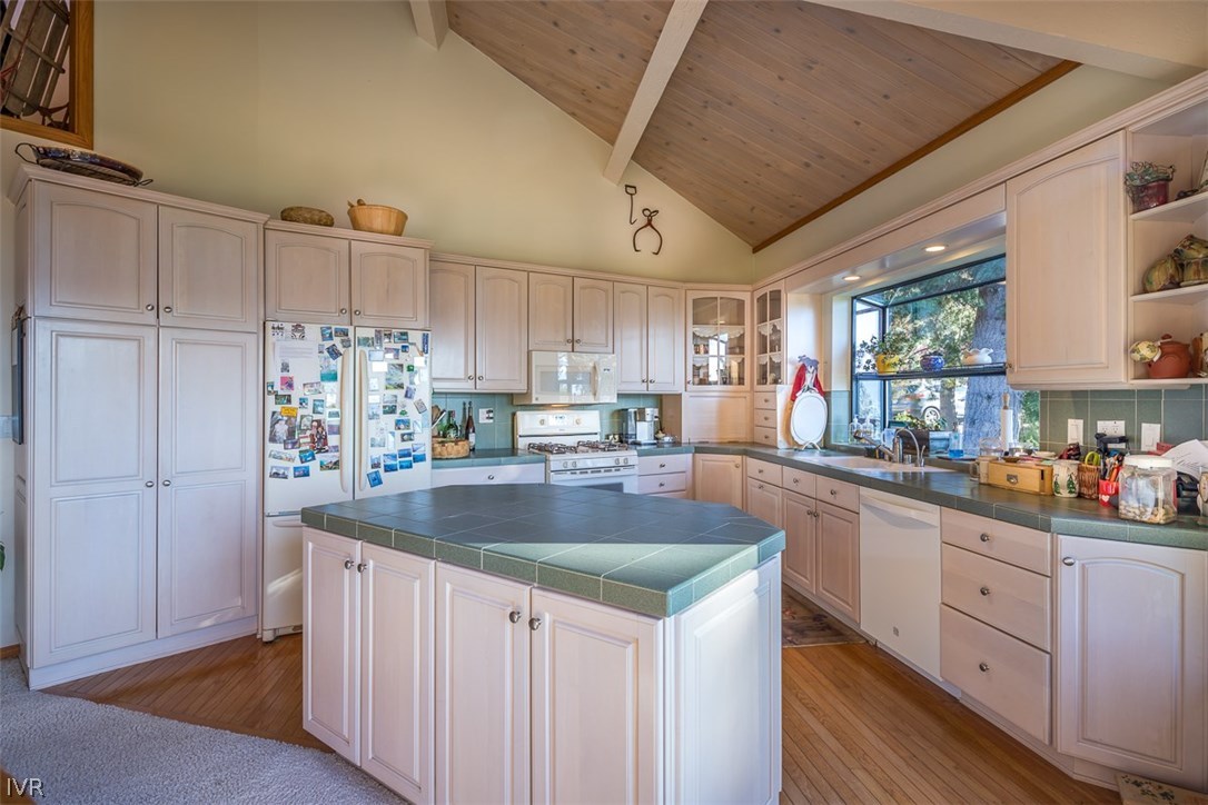 583 Fallen Leaf Way Incline Village, NV 89451 - Photo 6 of 30 a kitchen with kitchen island granite countertop a sink a counter space appliances and cabinets