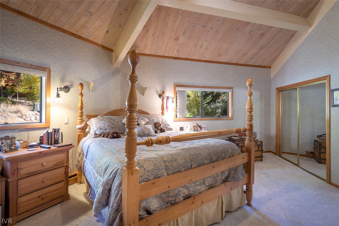 583 Fallen Leaf Way Incline Village, NV 89451 - Photo 8 of 30 a bedroom with a bed and large windows