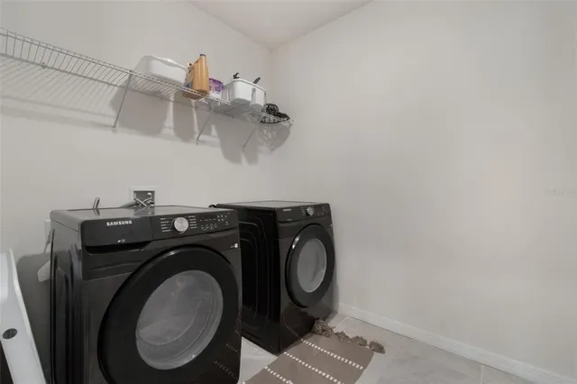 a utility room with dryer and washer