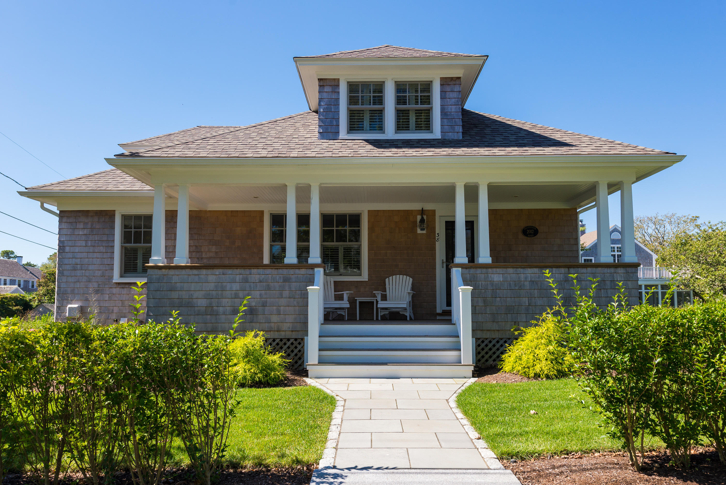 38 Mill Pond Road Chatham, MA 02633 - Photo 1 of 30 a front view of a house with garden