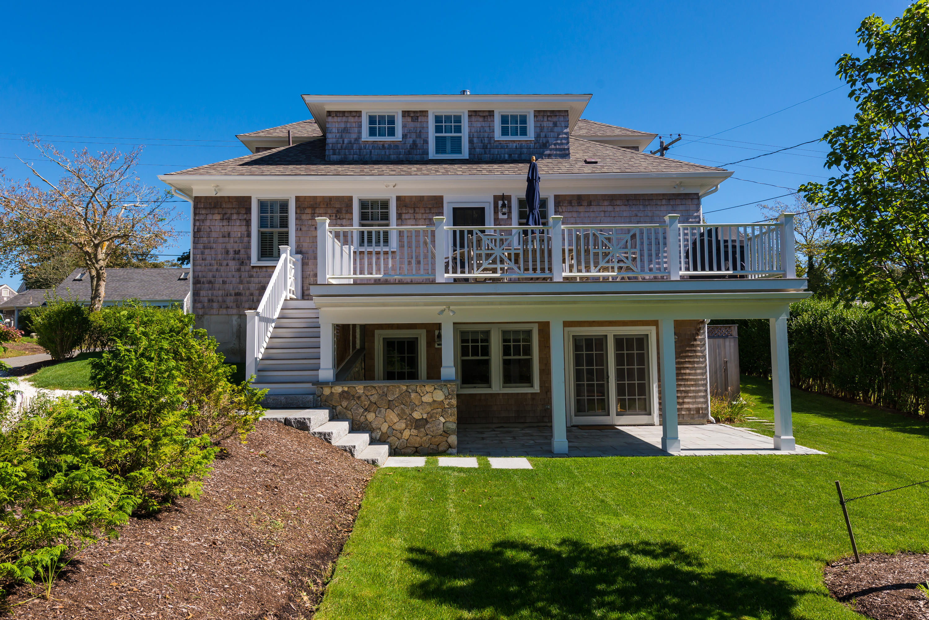 38 Mill Pond Road Chatham, MA 02633 - Photo 2 of 30 front view of a house with a yard
