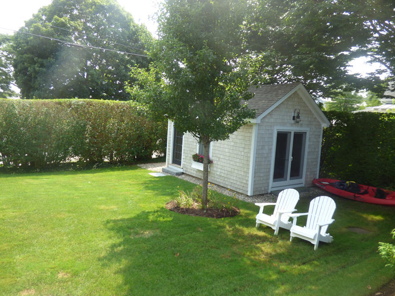 38 Mill Pond Road Chatham, MA 02633 - Photo 27 of 30 a front view of a house with garden