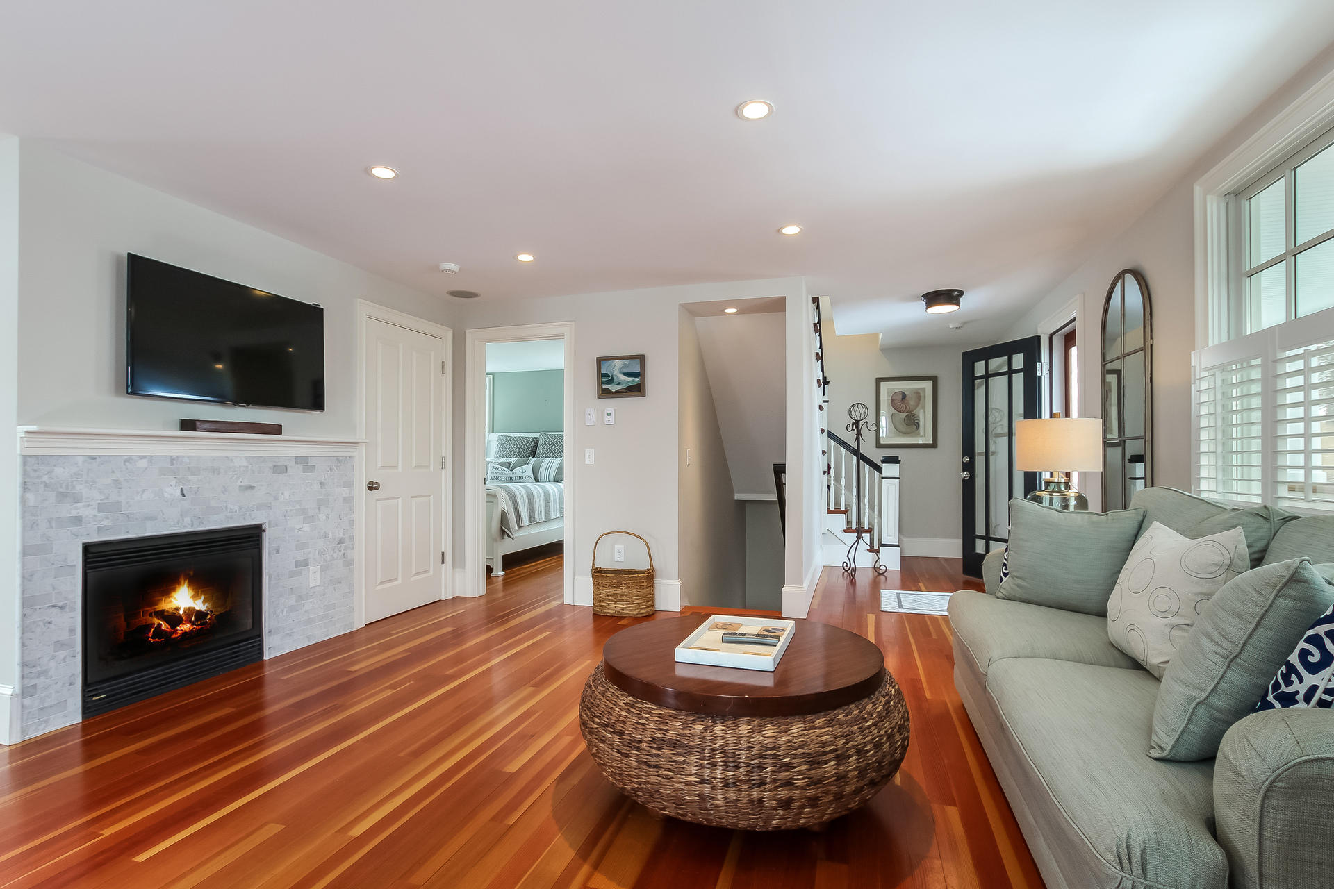 38 Mill Pond Road Chatham, MA 02633 - Photo 5 of 30 a living room with furniture a fireplace and a flat screen tv