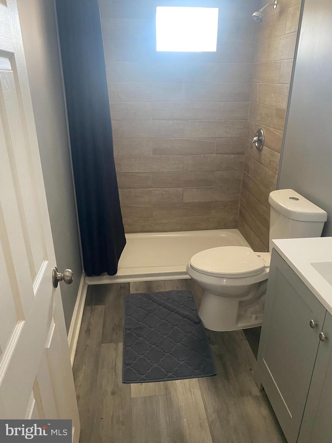 3643 Greenvale Road Baltimore, MD 21229 - Photo 15 of 23 a bathroom with a toilet and a shower