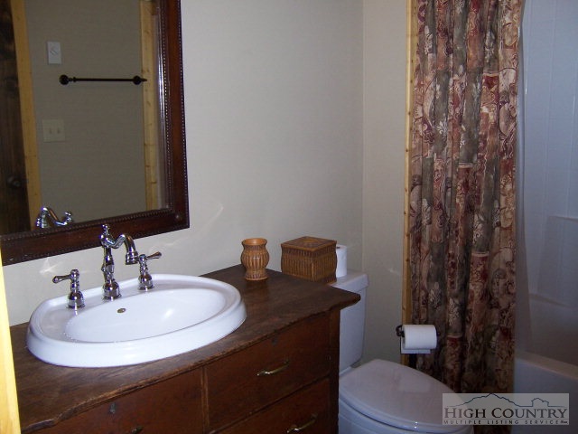 268 Old Megs Lane Boone, NC 28607 - Photo 4 of 12 a bathroom with a sink toilet and a mirror