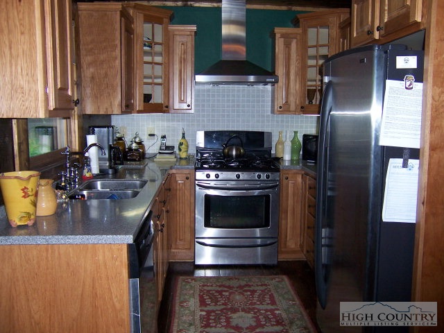 268 Old Megs Lane Boone, NC 28607 - Photo 7 of 12 a kitchen with a stove a refrigerator and a sink
