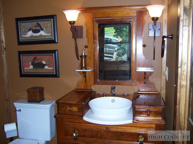 268 Old Megs Lane Boone, NC 28607 - Photo 8 of 12 a bathroom with a sink a mirror and a window